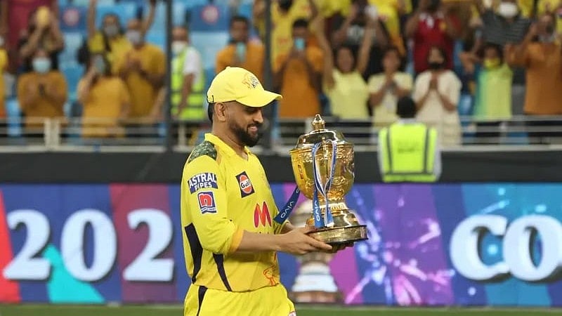 MS Dhoni with the IPL trophy. - File